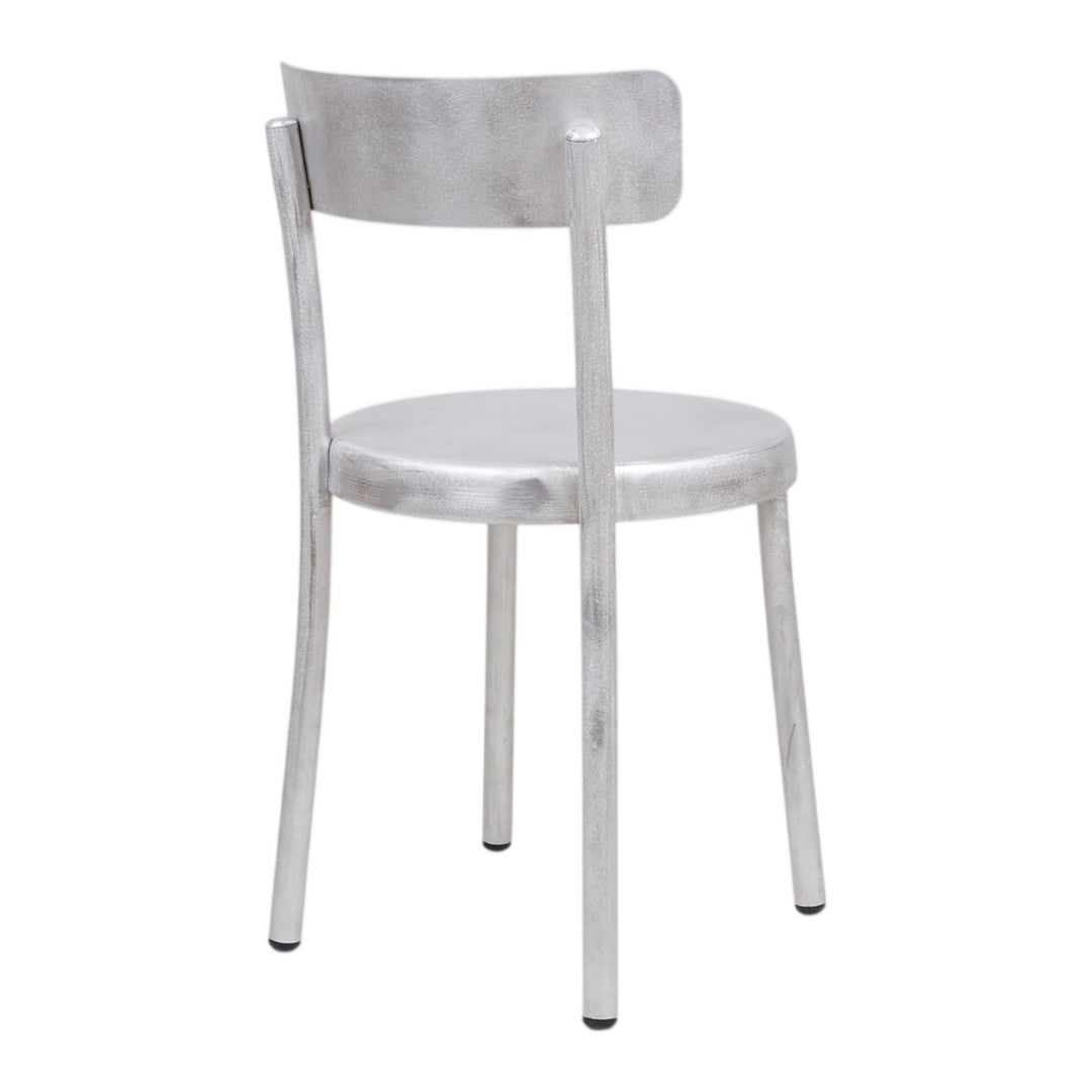 Metallic silver chair with a minimalist design, featuring a smooth, shiny finish and no patterns. Perfect for modern decor.