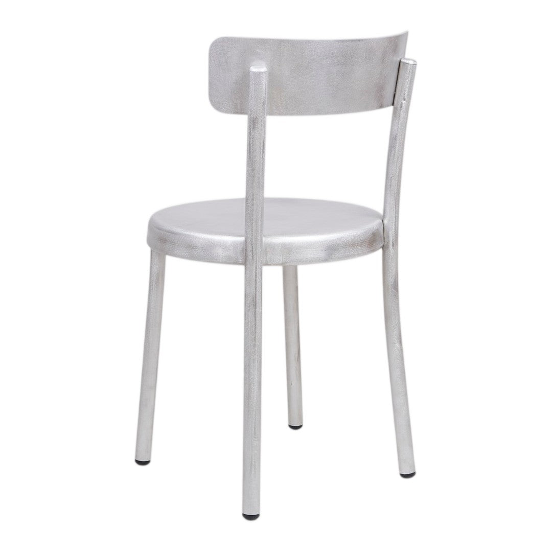 Silver metallic chair with a sleek, minimalist design and smooth, shiny finish. Ideal for modern decor.