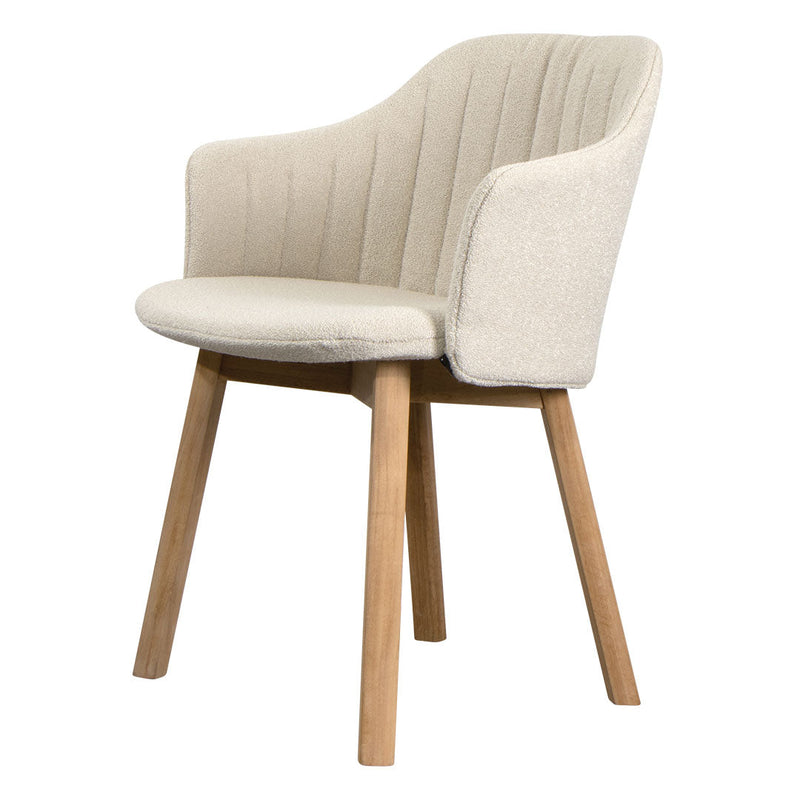 Beige upholstered chair with vertical ribbed pattern and light wood legs. Elegant and modern design for any space.