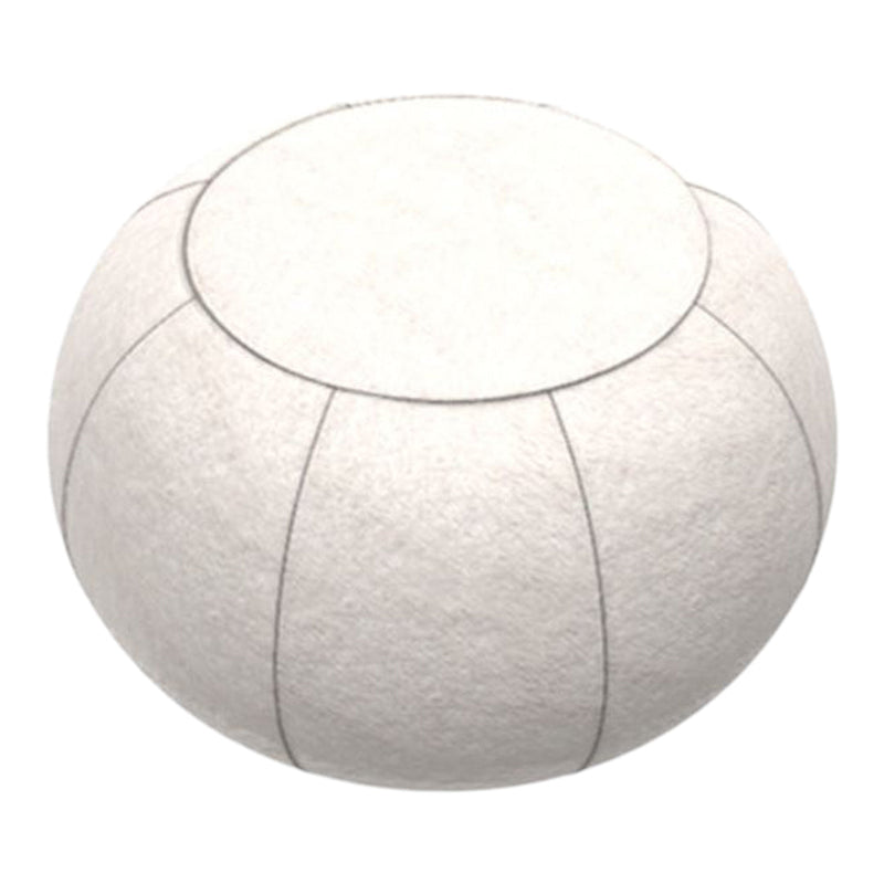White felt pouf with simple stitching details and a round, smooth surface for a modern aesthetic.
