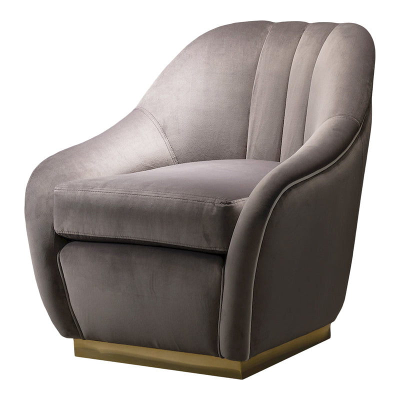 Sleek gray velvet armchair with soft contours and a gold base, perfect for modern decor.