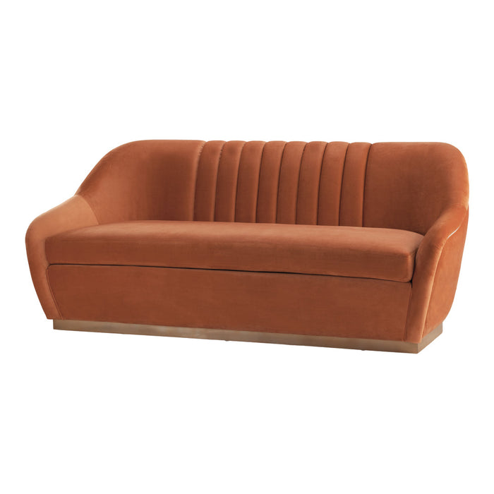 Rust orange velvet sofa with ribbed back detailing and a sleek gold base. Modern and stylish design for any living space.