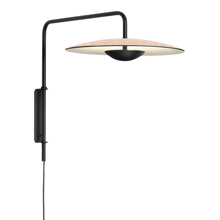 Black wall-mounted lamp with a circular beige shade and a simple, modern design.