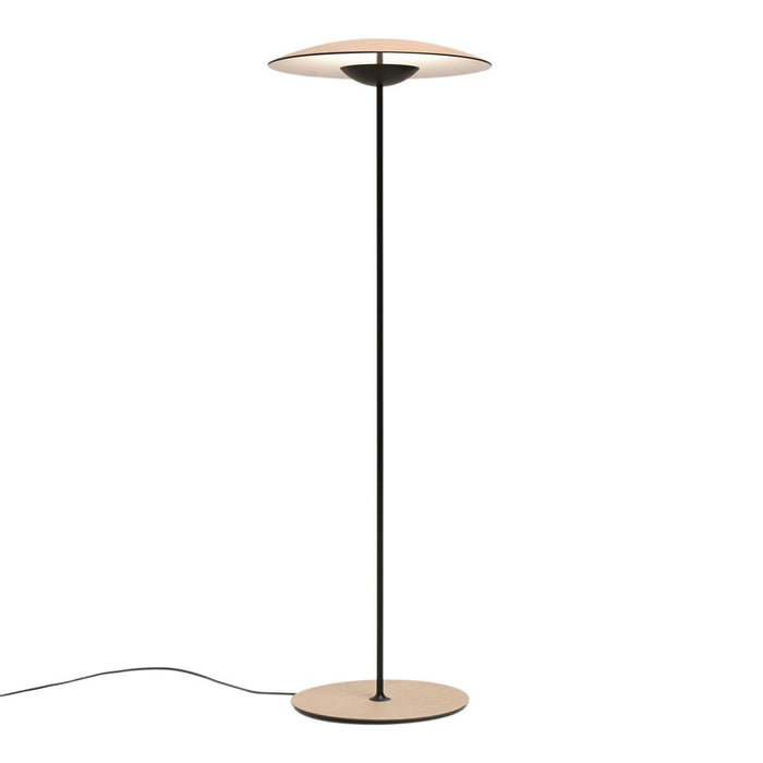 Minimalist black and beige floor lamp with a sleek, round shade and smooth, modern finish.