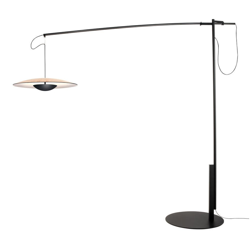 Modern black floor lamp with a sleek design and a circular light in warm tones, featuring clean lines and minimalist style.