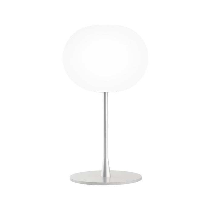 White globe lamp on a sleek silver base, featuring a modern minimalist design. Perfect for any contemporary decor.