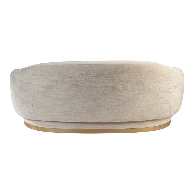 Beige upholstered sofa with a sleek, rounded design and a subtle sheen. Elegant gold base highlights modern style.
