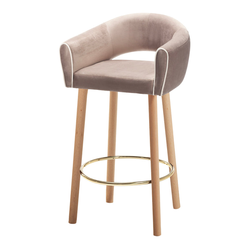 Sleek beige velvet bar stool with white piping and natural wood legs, featuring a gold footrest for a modern touch.
