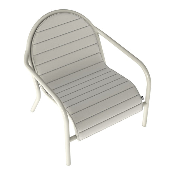 Light gray lounge chair with horizontal stripes and a rounded backrest, featuring a minimalist design and soft color palette.