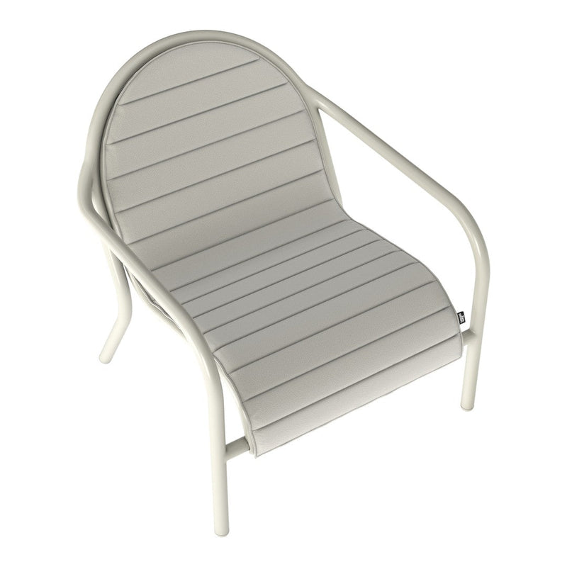 Light gray lounge chair with horizontal stripes and a rounded backrest, featuring a minimalist design and soft color palette.