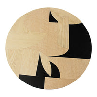 Circular wooden design featuring a mix of light wood and bold black patterns. Modern geometric aesthetics.