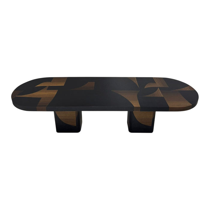 Stylish black coffee table with geometric brown patterns on the surface, featuring an oval shape and bold design.