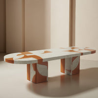 Geometric coffee table with orange and white abstract patterns, featuring a smooth, modern design.