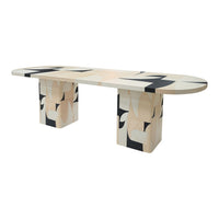 Multi-colored geometric dining table featuring soft beige, black, and white patterns. Modern art-inspired design.