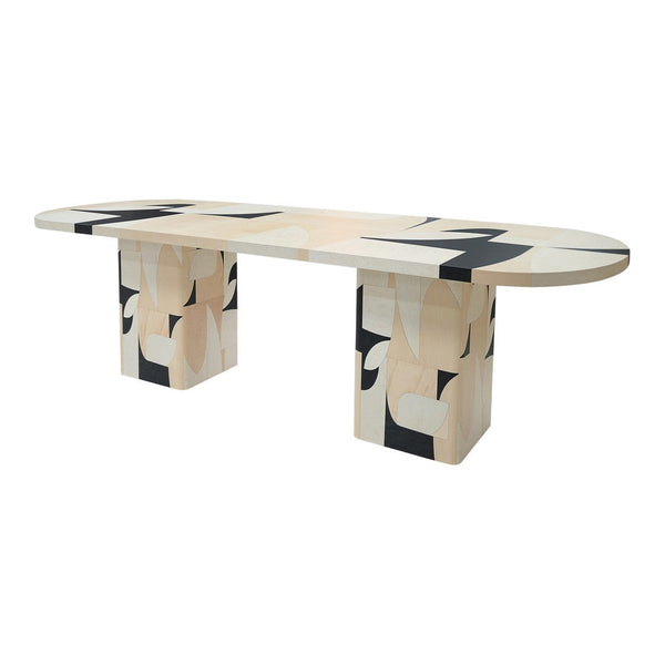 Multi-colored geometric dining table featuring soft beige, black, and white patterns. Modern art-inspired design.