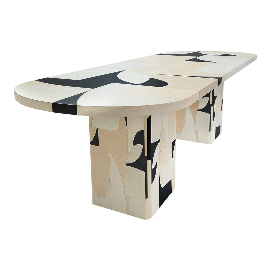 Modern table featuring a blend of abstract black and cream patterns with a smooth, oval top.