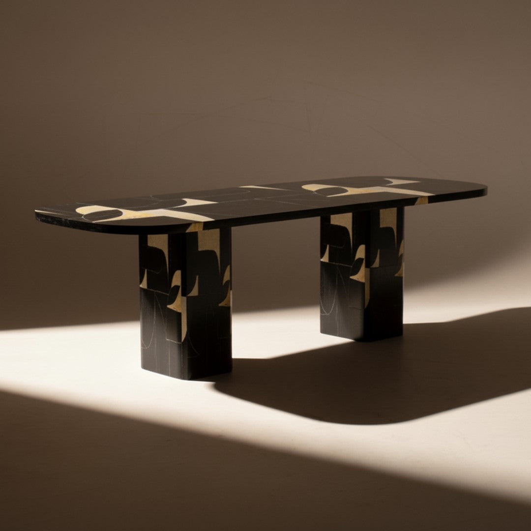 Black and gold patterned table with a sleek design, featuring striking geometric shapes and a modern aesthetic.