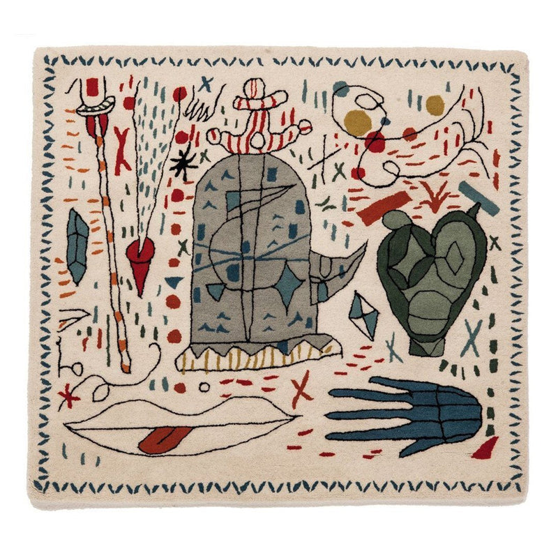 Colorful patterned rug featuring abstract designs in blue, red, green, and cream tones with whimsical motifs.