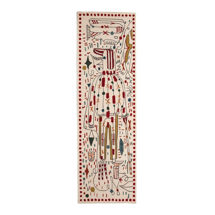Colorful handmade textile featuring vibrant patterns in red, green, yellow, and black on a cream background.
