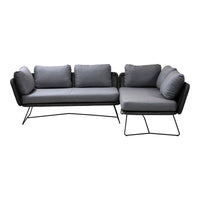 Gray fabric sectional sofa with plush cushions and sleek black metal legs. Modern design with clean lines and textured pattern.
