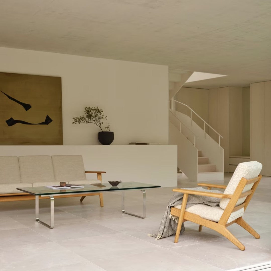 Modern interior featuring neutral shades of white and cream, with natural wood accents and minimalist decor.