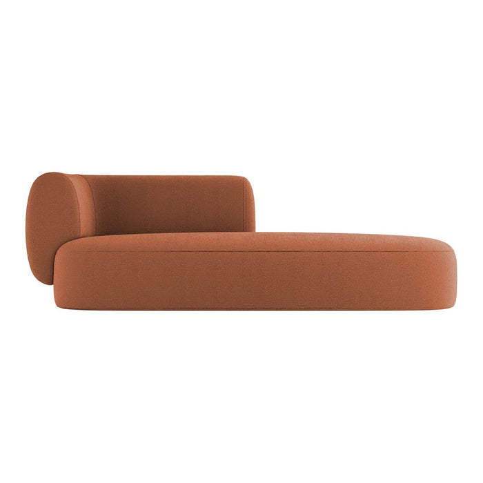 Stylish chaise lounge in warm terracotta with a smooth, modern design and minimalistic shape. Ideal for any space.