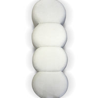White textured cushion set with smooth, rounded shapes stacked vertically, adding a modern touch to any decor.