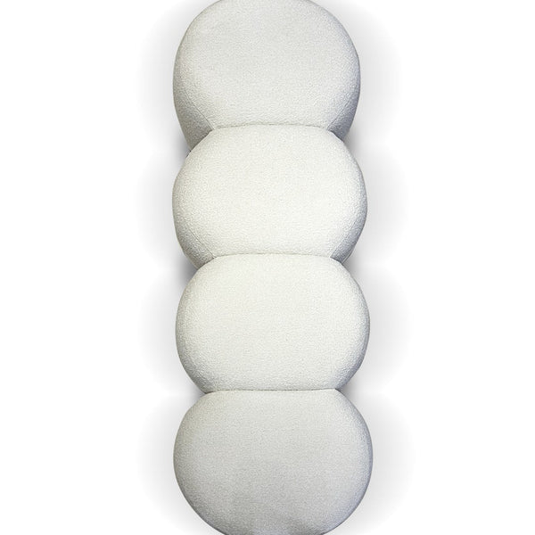 White textured cushion set with smooth, rounded shapes stacked vertically, adding a modern touch to any decor.