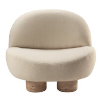 Soft beige boucle fabric chair with a rounded shape and cork legs, perfect for modern decor.