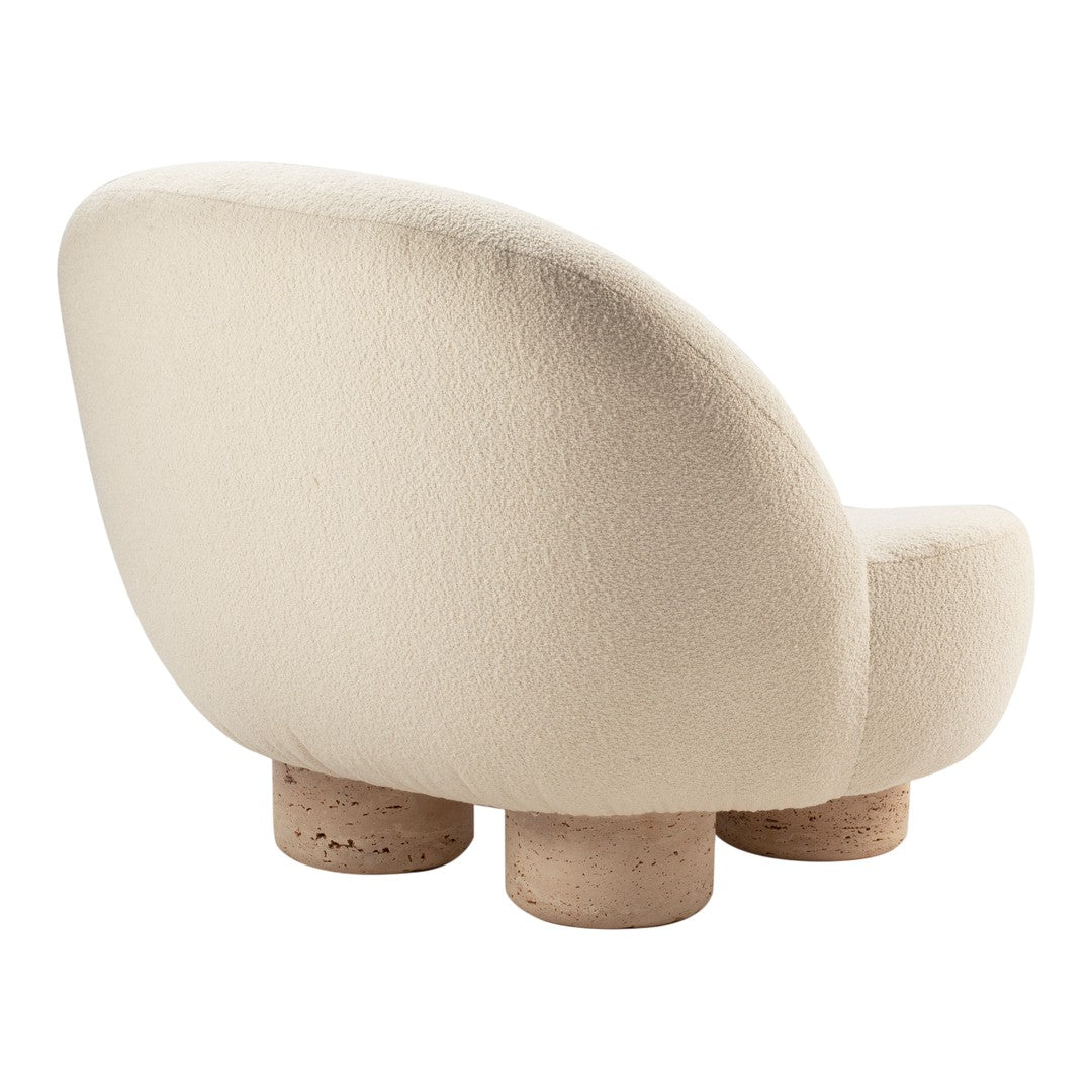 Cream textured upholstery with a round shape and natural cork legs. Elegant minimalist design for modern interiors.