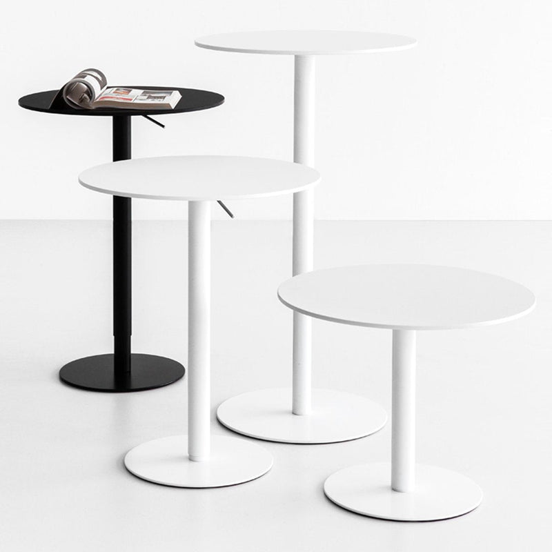 "Modern side tables in sleek black and white finishes with minimalist round tops and sturdy bases."
