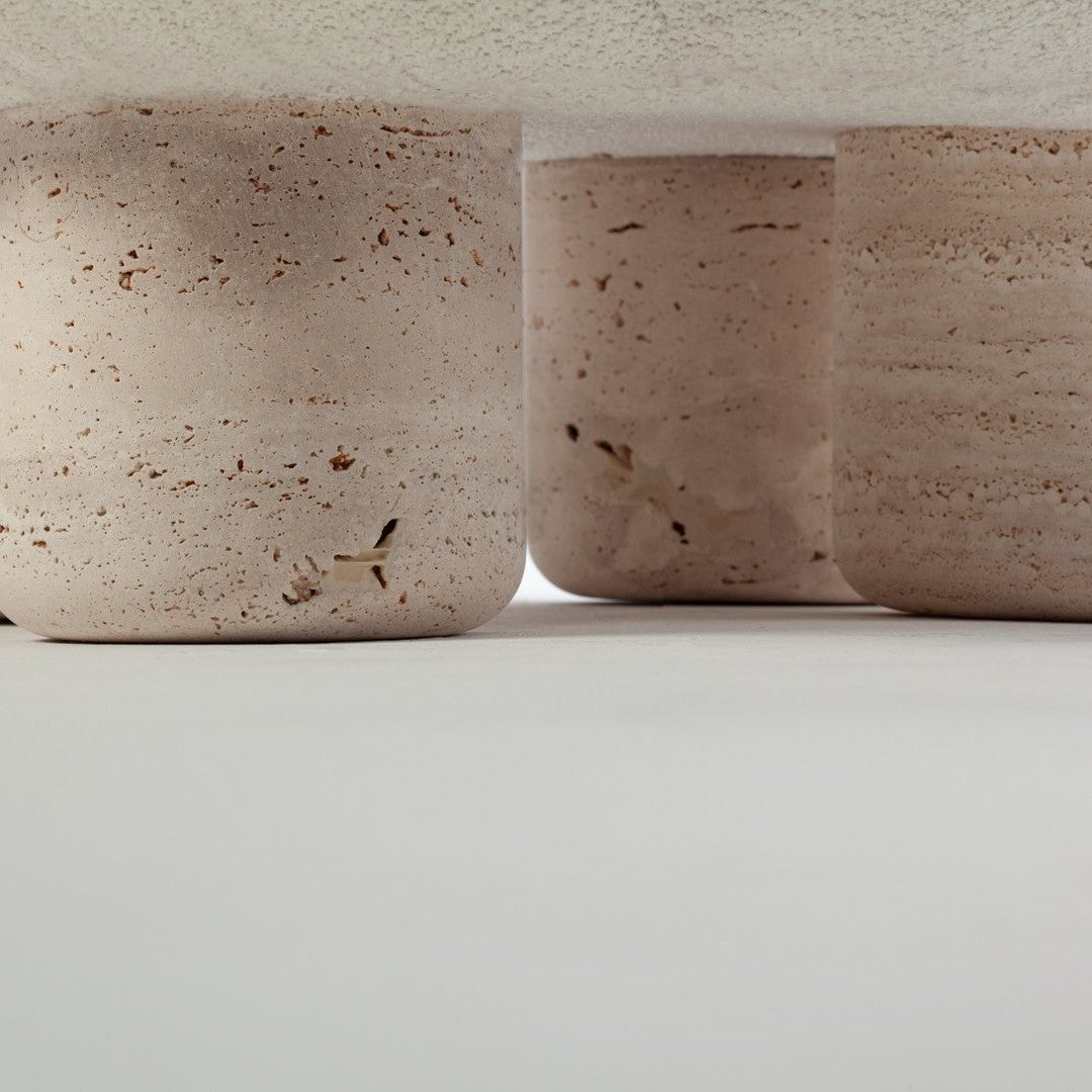 Light pink textured concrete pots with subtle earthy flecks, showcasing a modern and minimalist aesthetic.