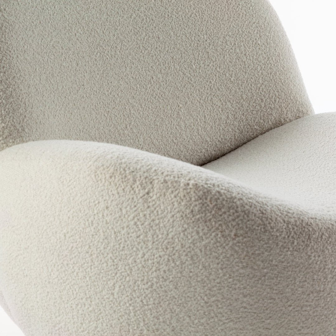 Soft beige chair with a textured, fuzzy pattern for a modern, cozy aesthetic. Ideal for stylish interiors.
