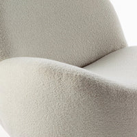 Soft beige chair with a textured, fuzzy pattern for a modern, cozy aesthetic. Ideal for stylish interiors.