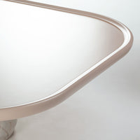 Sleek curved edge in soft beige against a clean white background with subtle marble accents.