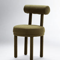 Olive green upholstered chair with a rounded backrest and textured fabric, featuring cylindrical legs.