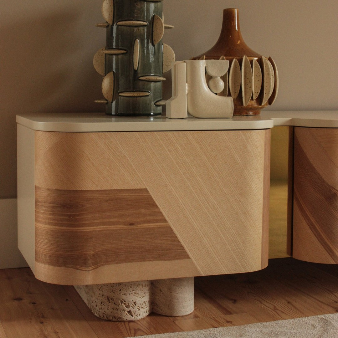 Modern wood sideboard with light brown and natural wood patterns, featuring smooth lines and a sleek finish.