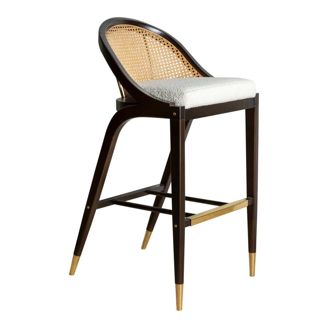 Brown rattan bar stool with white cushion and gold accents, featuring a sleek, modern design.