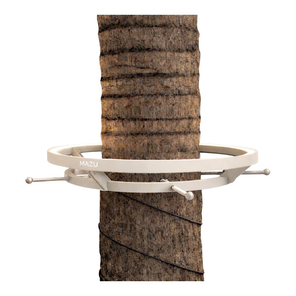 White circular tree guard against a textured brown tree trunk, featuring sleek modern design and minimalist accents.