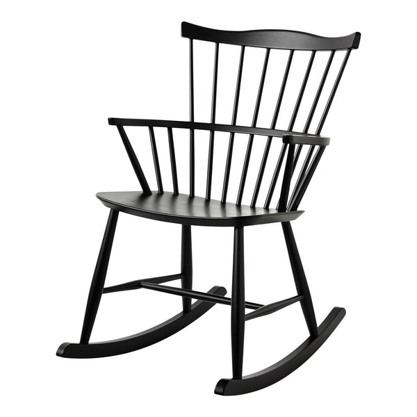Black wooden rocking chair with a classic spindle back design and smooth finish. Ideal for modern décor.