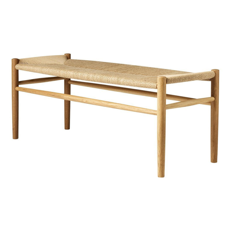 Natural wood bench with a light beige woven seat and minimalistic design, showcasing a simple, modern aesthetic.