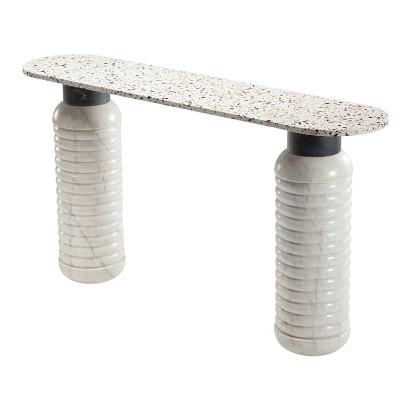 Modern console table featuring a speckled white top and textured gray cylindrical bases for a stylish accent.