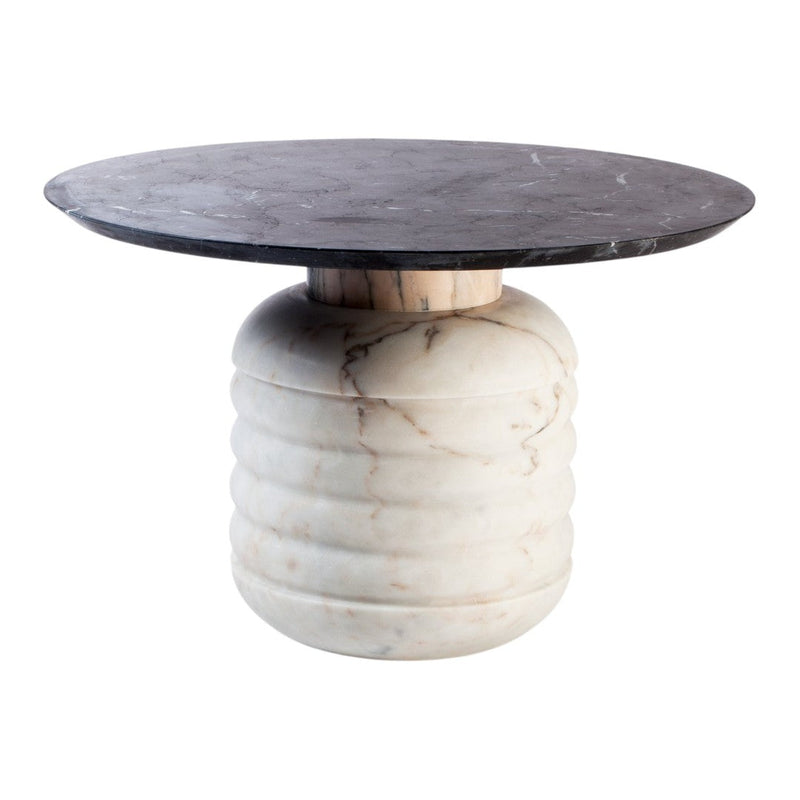 Round black marble top with a ribbed white marble base. Elegant, modern design featuring contrasting colors and textures.