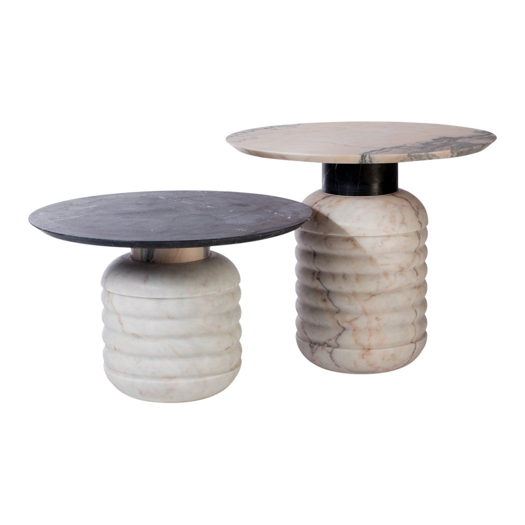 "Elegant round side tables in black and white, featuring unique textured patterns and contrasting marble finishes."