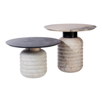 "Elegant round side tables in black and white, featuring unique textured patterns and contrasting marble finishes."