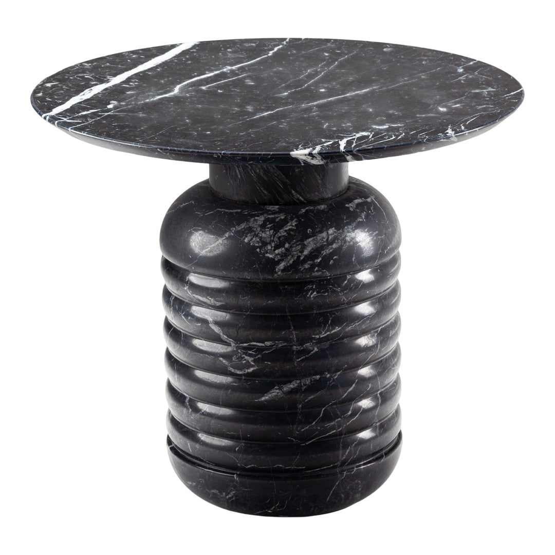 Black marble side table with white veining and a ribbed cylindrical base, featuring a smooth, round top.