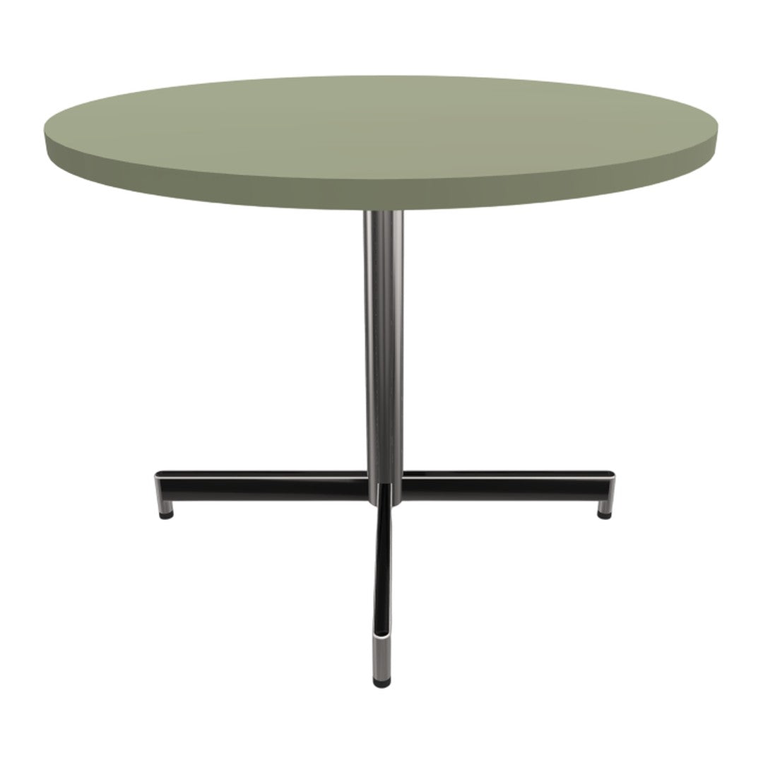Round table with a soft green tabletop and sleek black metal base, perfect for modern decor.