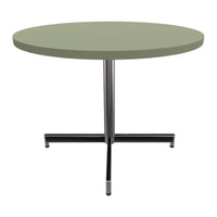Round table with a soft green tabletop and sleek black metal base, perfect for modern decor.