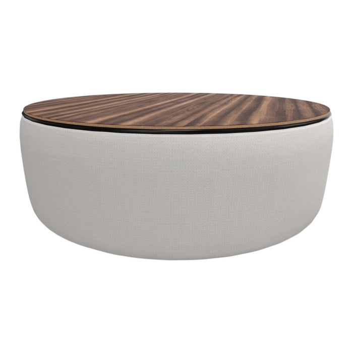 Round coffee table with a smooth white cushion base and a rich dark wood patterned top. Elegant and modern design.
