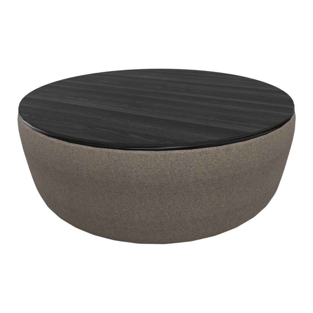 Round coffee table featuring a dark wood top and a soft, beige fabric base for a modern look.